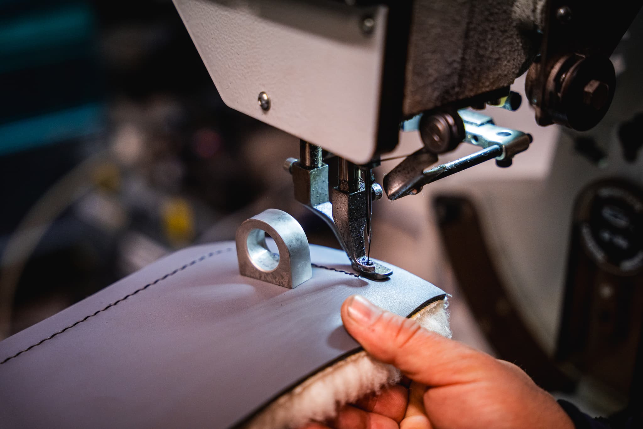 Italian craftsmanship — hand-stitching a fender cover